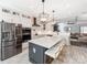 Spacious kitchen boasting an island with seating and an open layout to the living area at 12510 Pine Terrace Ct, Charlotte, NC 28273