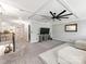 Bright living room featuring a decorative ceiling, fan, television, and stairway to the second level at 12510 Pine Terrace Ct, Charlotte, NC 28273