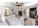 Spacious main bedroom featuring a sitting area, ceiling fan, neutral colors, and ensuite bath at 12510 Pine Terrace Ct, Charlotte, NC 28273