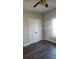 Bedroom featuring a window, dark floors, gray walls, and double doors to closet space at 1303 W Gold Street Ext, Kings Mountain, NC 28086