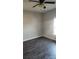 Bedroom has dark floors, gray walls, a ceiling fan, and a window that provides natural light at 1303 W Gold Street Ext, Kings Mountain, NC 28086