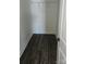 Walk in closet with gray walls, a built in shelf, a single hanging rod, and dark wood-look floors at 1303 W Gold Street Ext, Kings Mountain, NC 28086