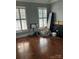 Empty bedroom featuring hardwood floors and windows with closed shutters at 1308 Moonshadow Ln, Shelby, NC 28150