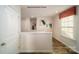 Upstairs hallway with a view into a bedroom, plus a bedroom door at 1314 37Th Avenue Ne Ln, Hickory, NC 28601