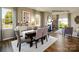 Open-concept dining room adjacent to the living room, with a table set for four and elegant decor at 1447 Mammoth Rd, Hickory, NC 28602