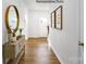 Bright hallway featuring hardwood floors, neutral walls, decor and natural light streaming through the front door at 1447 Mammoth Rd, Hickory, NC 28602