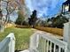 A well-maintained back yard featuring a lawn and a wooden privacy fence at 1946 Academy St, Charlotte, NC 28205