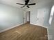 Clean bedroom featuring wood-look flooring, and a ceiling fan at 1946 Academy St, Charlotte, NC 28205