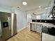 Updated kitchen featuring stainless steel appliances, granite countertops, and sleek modern cabinetry, connected to the living area at 1946 Academy St, Charlotte, NC 28205