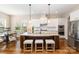 Gourmet kitchen with large island, granite countertops, stainless appliances, and breakfast area at 2110 Capricorn Ave, Indian Trail, NC 28079