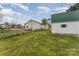 Backyard featuring a green storage shed and white siding on home at 230 Dunham Ave, Salisbury, NC 28146