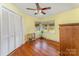 Bright bedroom with hardwood floors, a ceiling fan, and a closet at 230 Dunham Ave, Salisbury, NC 28146