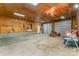 Spacious garage with plywood walls, cement flooring and two garage doors at 230 Dunham Ave, Salisbury, NC 28146