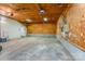 Large garage with plywood walls, concrete floor, and lots of open space at 230 Dunham Ave, Salisbury, NC 28146