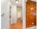 Hallway featuring wood paneling and access to multiple rooms in the home at 230 Dunham Ave, Salisbury, NC 28146