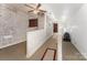 Bright hallway with brick wall, ceiling fan, and access to other rooms at 230 Dunham Ave, Salisbury, NC 28146