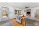 Bright living room featuring hardwood floors, a ceiling fan, and a view to the front yard at 230 Dunham Ave, Salisbury, NC 28146