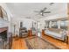 Cozy living room featuring hardwood floors, a ceiling fan, and natural light at 230 Dunham Ave, Salisbury, NC 28146