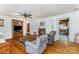 Cozy living room with fireplace, ceiling fan and hardwood floors, adjacent to the kitchen at 230 Dunham Ave, Salisbury, NC 28146