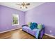 Bedroom with wood flooring, ceiling fan, and a sunny window at 2966 Huckleberry Hill Dr, Fort Mill, SC 29715