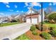 Inviting home with a two-car garage, brick accents, and a well-kept lawn in a lovely neighborhood at 2966 Huckleberry Hill Dr, Fort Mill, SC 29715