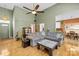 Cozy living room with hardwood floors, comfortable seating, and a ceiling fan at 2966 Huckleberry Hill Dr, Fort Mill, SC 29715