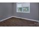 Clean bedroom with durable floors, neutral walls, and a bright window at 326 Mountain View St, Gastonia, NC 28052