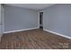 A spacious room features modern flooring and neutral paint at 326 Mountain View St, Gastonia, NC 28052