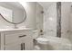 Renovated bathroom featuring stylish vanity, modern fixtures, and updated shower at 4124 Woodfox Dr, Charlotte, NC 28277