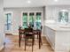 Dining area with view to the kitchen and backyard, offering ample space and natural light at 4124 Woodfox Dr, Charlotte, NC 28277