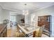 Elegant dining room with hardwood floors, unique chandelier, and stylish furniture at 4124 Woodfox Dr, Charlotte, NC 28277