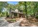 Charming home with stone accents, well-maintained landscaping, and mature trees at 4124 Woodfox Dr, Charlotte, NC 28277