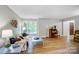 Bright living room with hardwood floors, large windows, and modern decor at 4124 Woodfox Dr, Charlotte, NC 28277