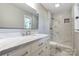 Elegant bathroom boasts a marble vanity and luxurious walk-in shower at 4124 Woodfox Dr, Charlotte, NC 28277