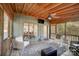 Comfortable screened porch with seating area, ceiling fan, and natural lighting at 4124 Woodfox Dr, Charlotte, NC 28277