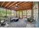 Relaxing screened porch with ceiling fan and comfortable seating at 4124 Woodfox Dr, Charlotte, NC 28277