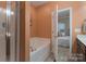 Bathroom with a separate tub, shower stall, and access to bedroom at 623 Hicklin Dr, Rock Hill, SC 29732