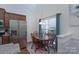 Bright dining area showcasing wooden table set, pendant lighting, and natural light at 623 Hicklin Dr, Rock Hill, SC 29732