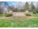 Stone community entrance sign with landscaping and seasonal flowers at Millwood Plantation at 623 Hicklin Dr, Rock Hill, SC 29732