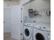 Functional laundry room with modern Samsung washer and dryer and practical wire shelving at 623 Hicklin Dr, Rock Hill, SC 29732