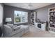 Sitting room with grey walls, a comfortable couch, a fireplace, and built-in bookcases at 623 Hicklin Dr, Rock Hill, SC 29732