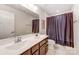 Bathroom with double sinks, framed mirror, and a shower with a curtain at 7027 Waterwheel St, Concord, NC 28025