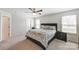 Inviting bedroom featuring soft carpet, a ceiling fan, and soothing color palette at 7027 Waterwheel St, Concord, NC 28025