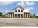 Exterior of community clubhouse featuring stone columns and well-maintained landscaping at 7027 Waterwheel St, Concord, NC 28025