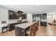 Beautiful kitchen featuring a large center island with seating, granite countertops, and stainless steel appliances at 7027 Waterwheel St, Concord, NC 28025