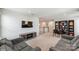 Upstairs living room area with TV, game console, bookshelf and sofas at 7027 Waterwheel St, Concord, NC 28025