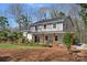 View of the side of a beautiful home with a covered porch and well-maintained landscaping at 7214 Benita Dr, Charlotte, NC 28212