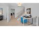 Hallway featuring light hardwood floors and modern black stair railings at 7214 Benita Dr, Charlotte, NC 28212