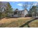 Cozy screened-in porch with comfortable seating and a tranquil view at 7214 Benita Dr, Charlotte, NC 28212