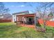 Backyard featuring a deck and a covered patio at 7619 Woodknoll Dr, Charlotte, NC 28217